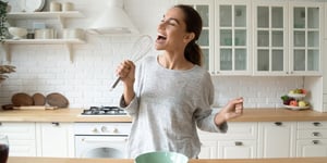 woman singing in kitchen